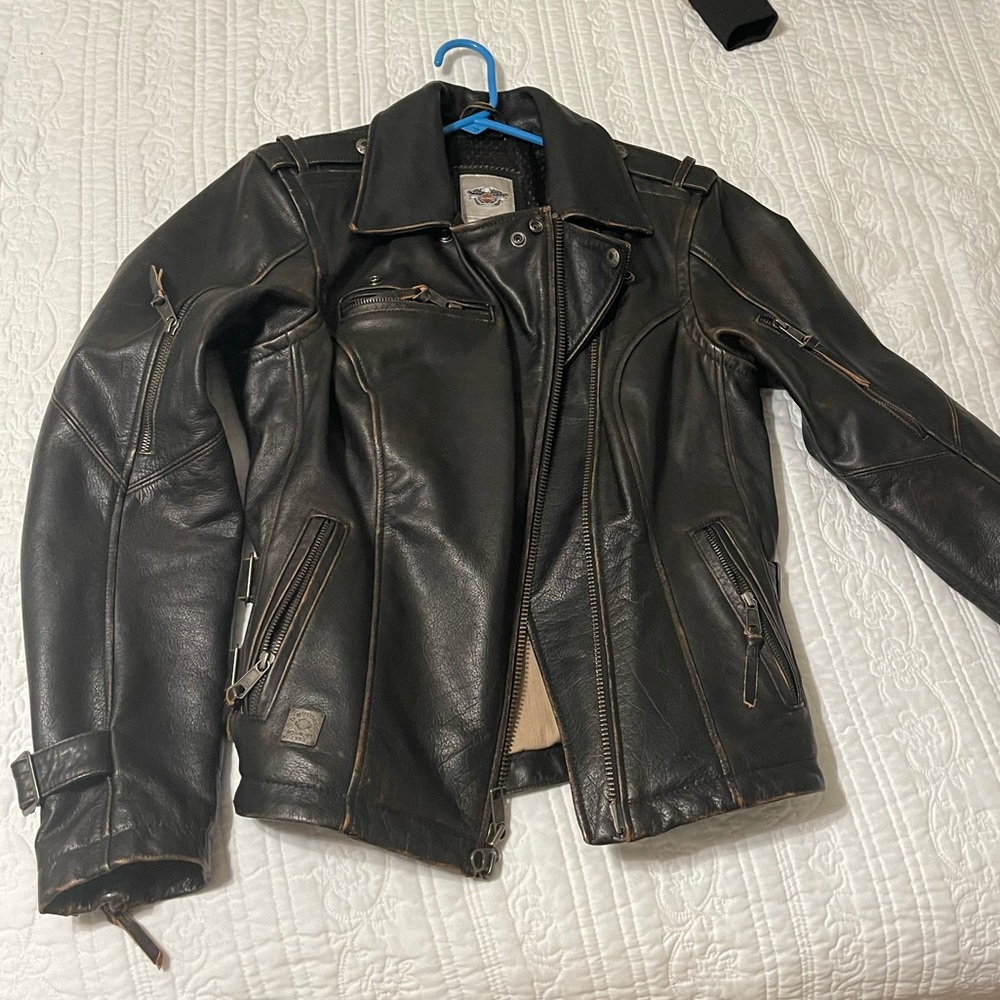 Woman’s Harley Davidson genuine leather riding coat size large.